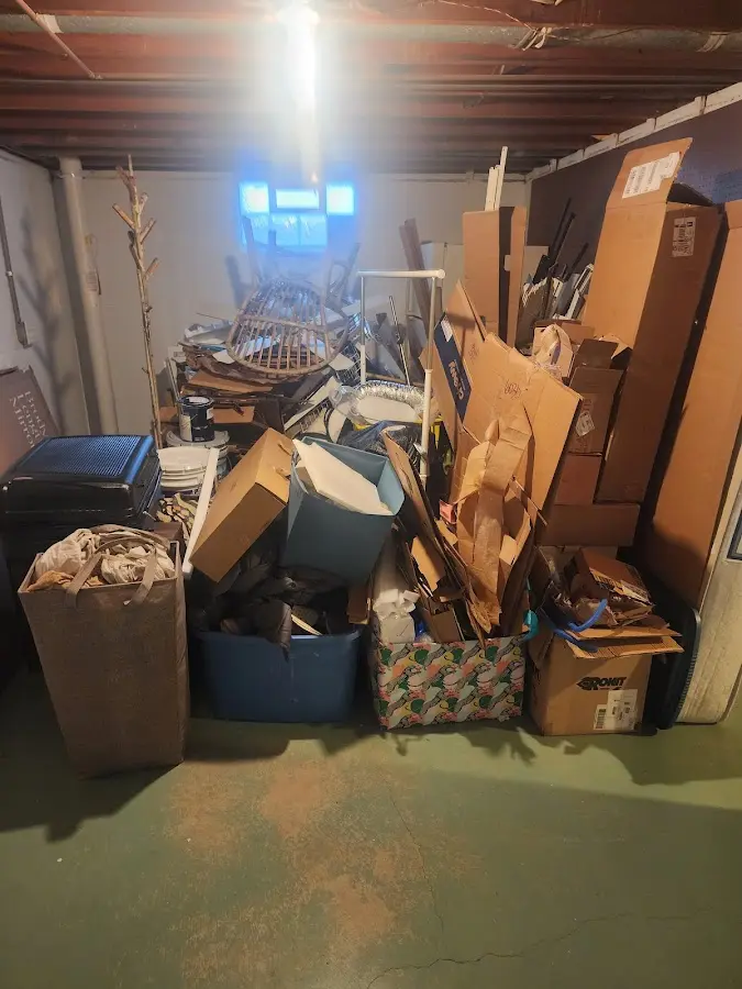 Roll-off dumpster container at job site for 2 Yard Dumpster Rental in Dellwood